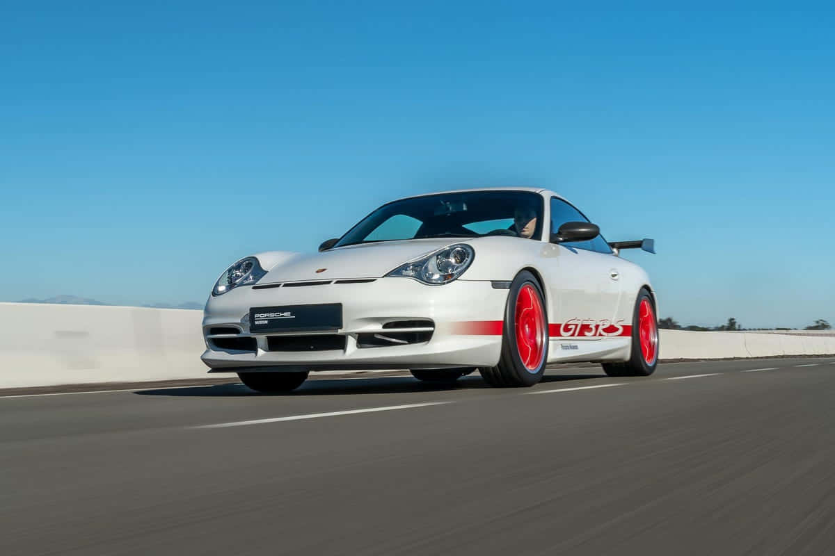 Pristine Porsche 996 On The Open Road Wallpaper