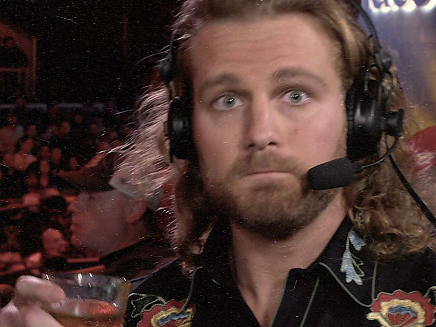 Pro Wrestler Adam Page Enjoying A Glass Of Whiskey Wallpaper