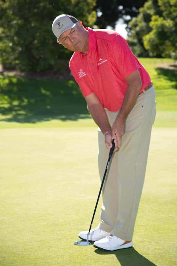 Professional Golf Player Ken Duke Getting Ready To Hit Wallpaper