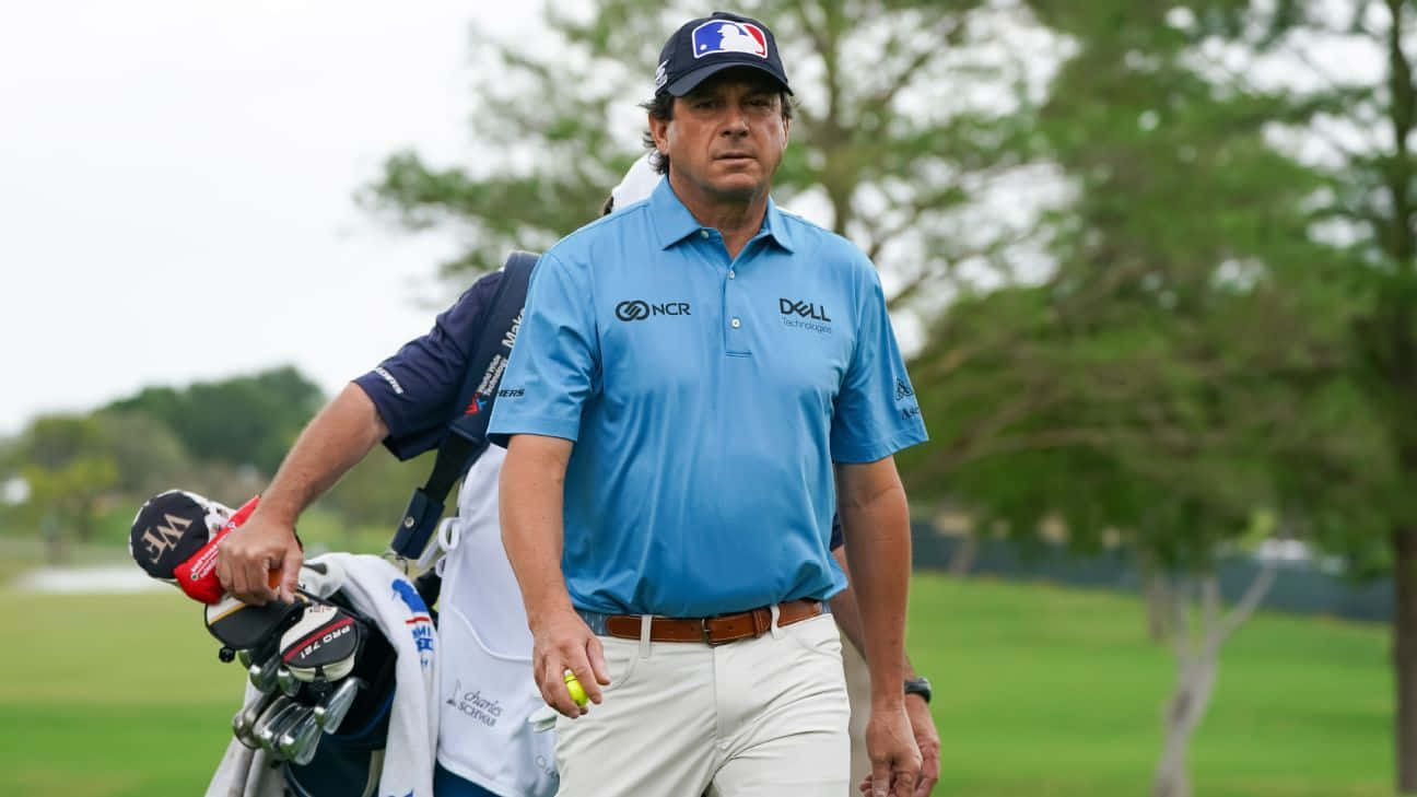 Professional Golfer Billy Andrade In Action With His Caddy Wallpaper