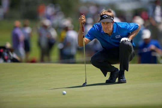 Professional Golfer Stuart Appleby Studying The Field Wallpaper