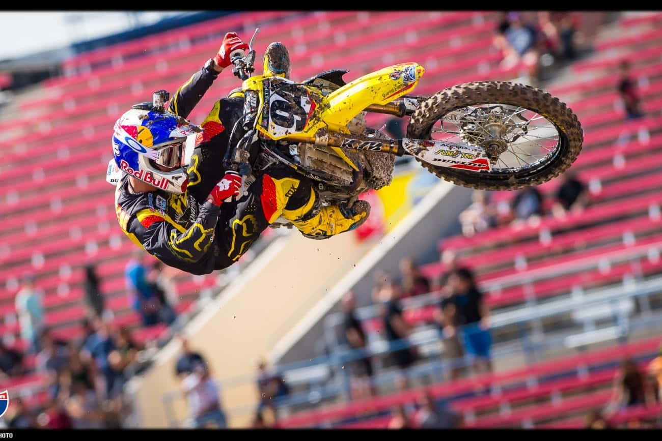 Professional Motocross Rider Ken Roczen Taking A Speed Turn Wallpaper