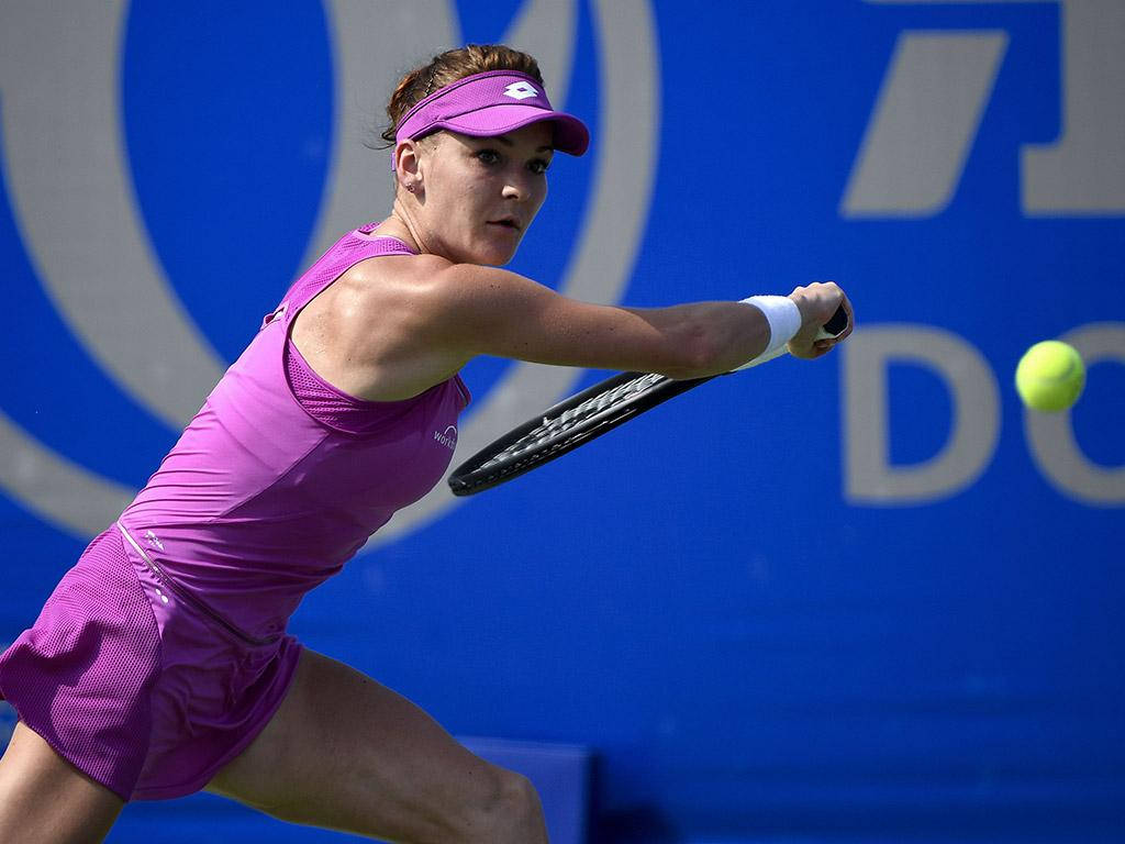 Professional Tennis Player Agnieszka Radwanska Executes A Backhand Stroke Wallpaper