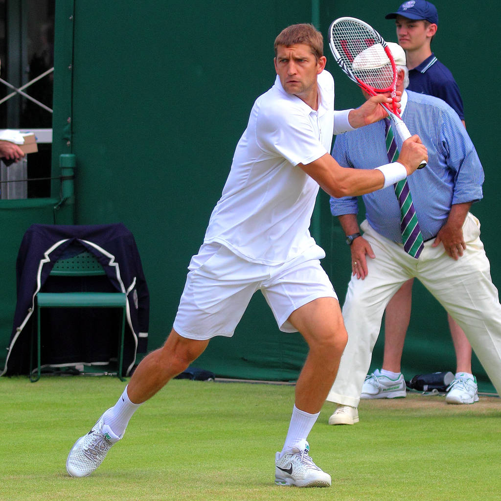 Professional Tennis Player Max Mirnyi In A Powerful Stroke Pose Wallpaper