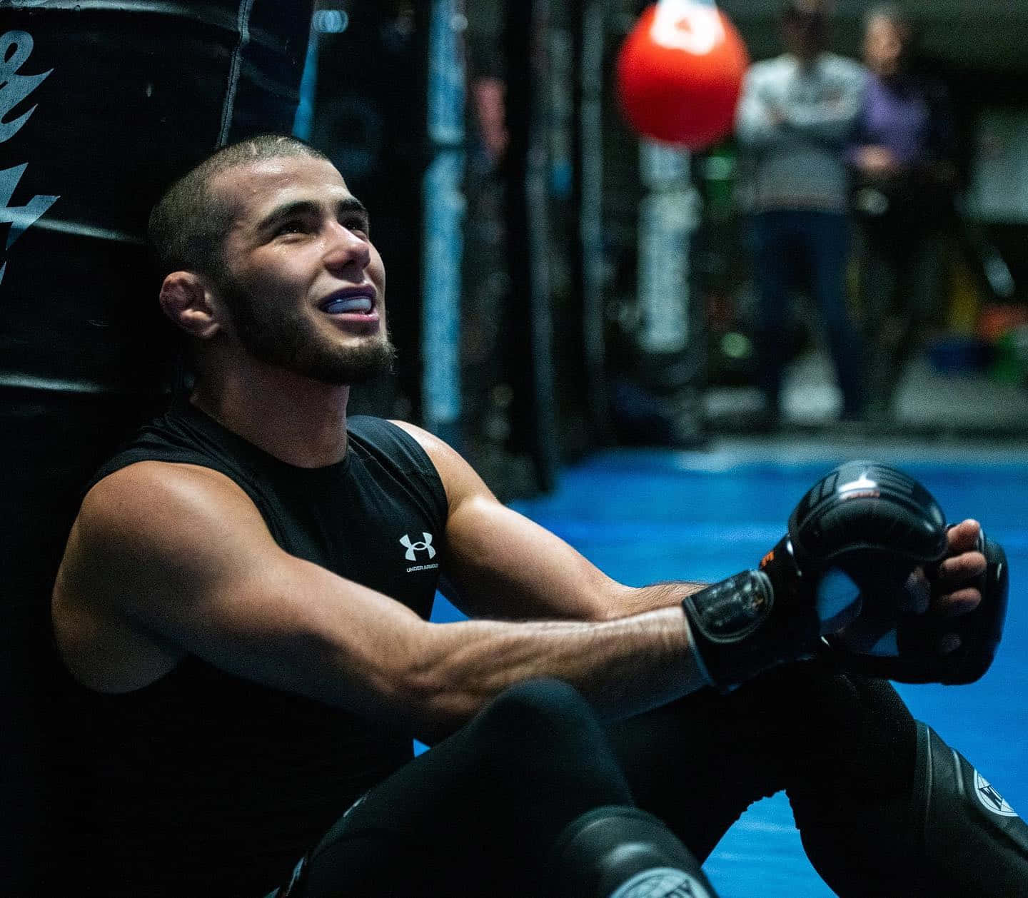 Prominent Mma Fighter, Muhammad Mokaev In Deep Thought During Training Wallpaper