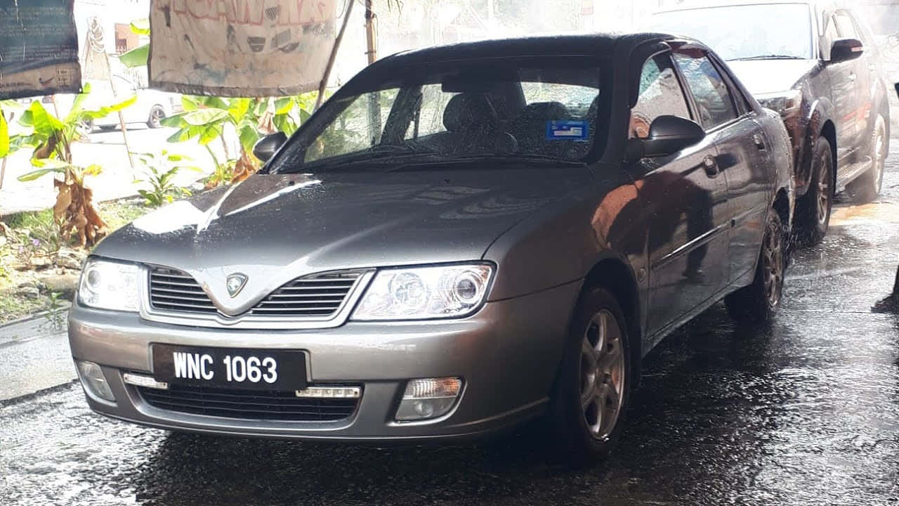 Proton_ Waja_ Grey_ Model_ Wet_ Road Wallpaper