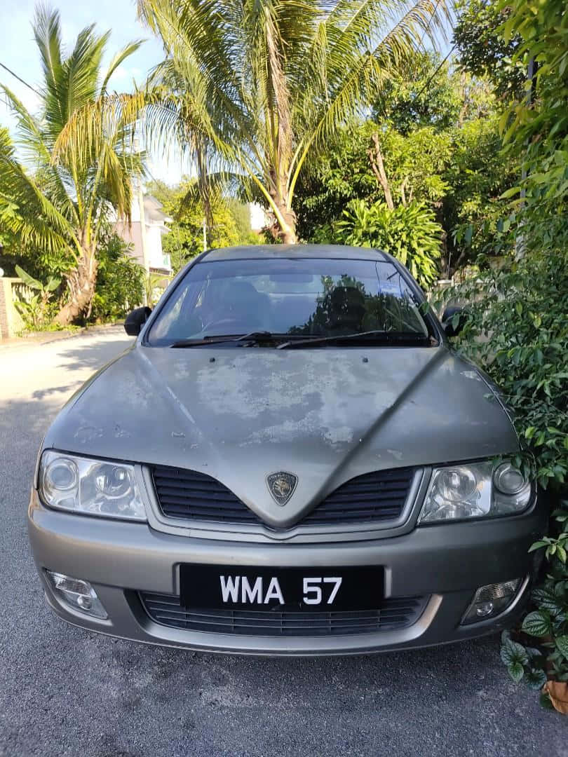 Proton Waja Parked Outdoors Wallpaper