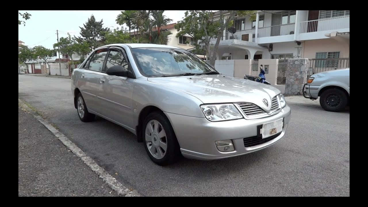 Proton Waja Silver Sedan Parked Outdoors Wallpaper