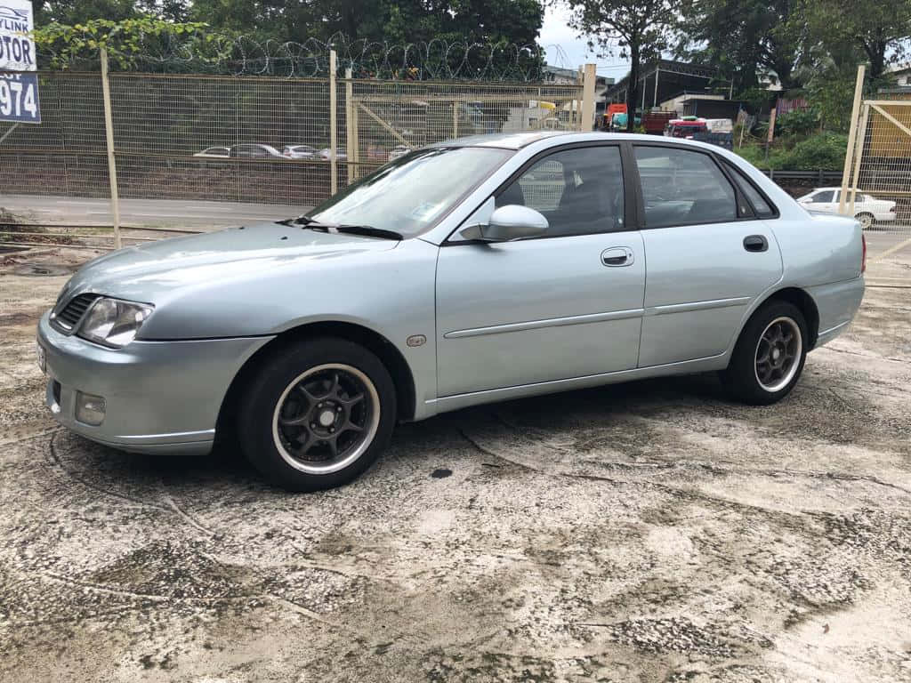 Proton Waja Silver Sedan Parked Wallpaper