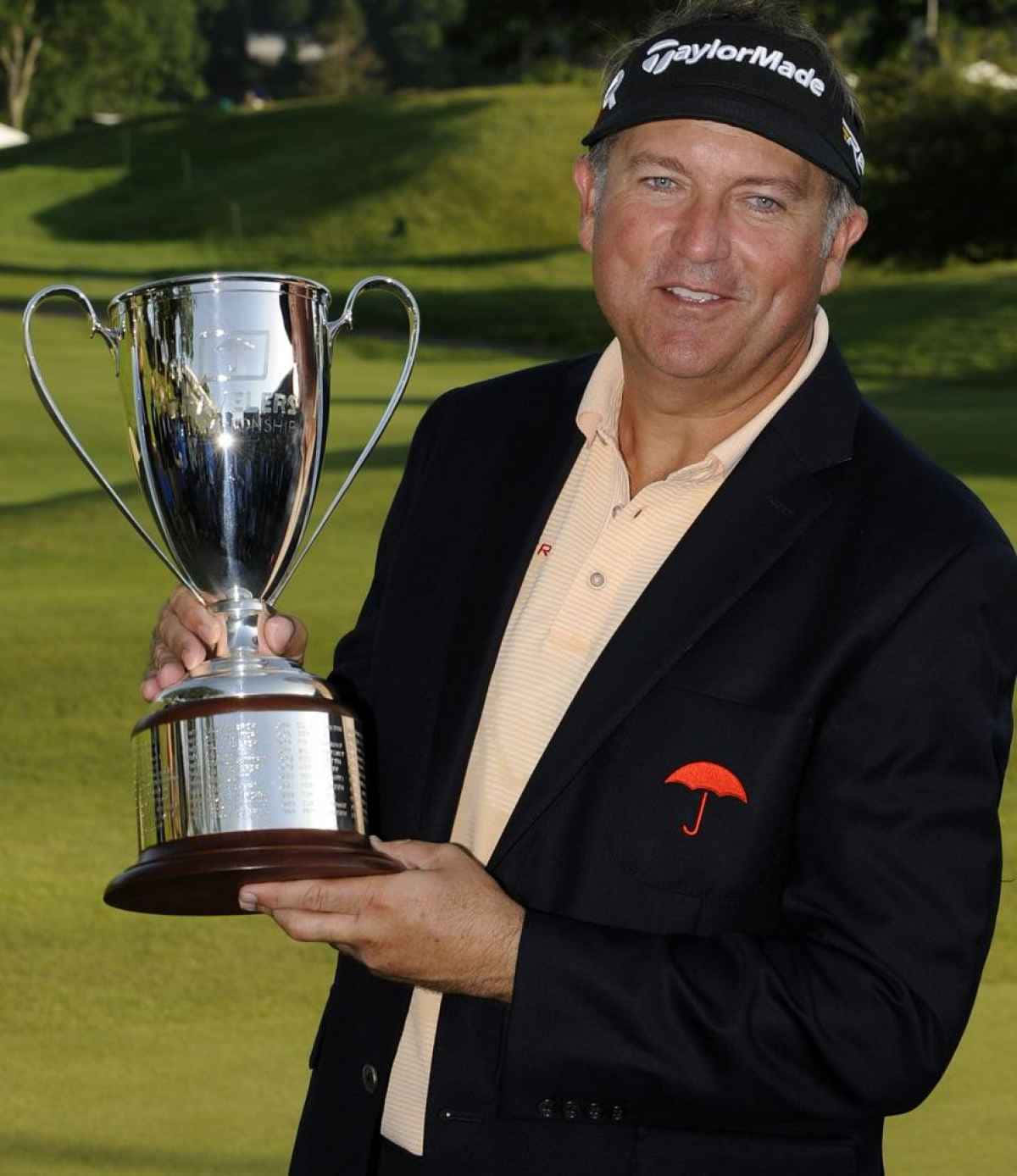 Proud Ken Duke Holding The Trophy He Recently Won. Wallpaper