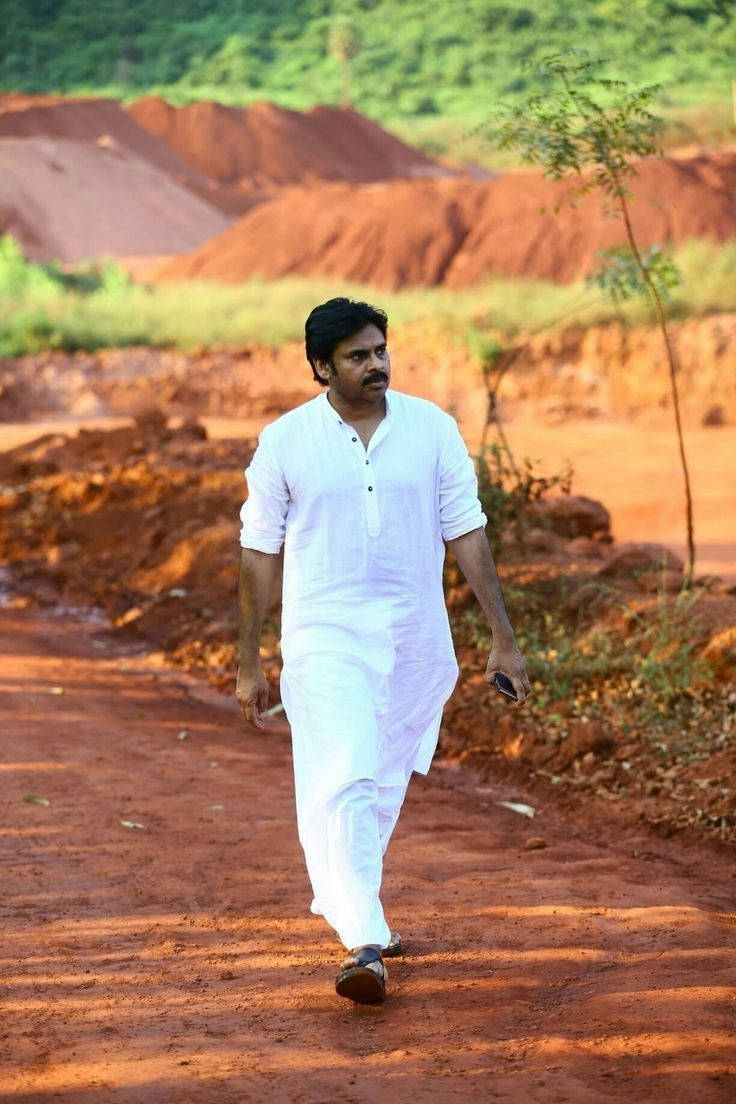 Pspk In White Walking On Dirt Wallpaper