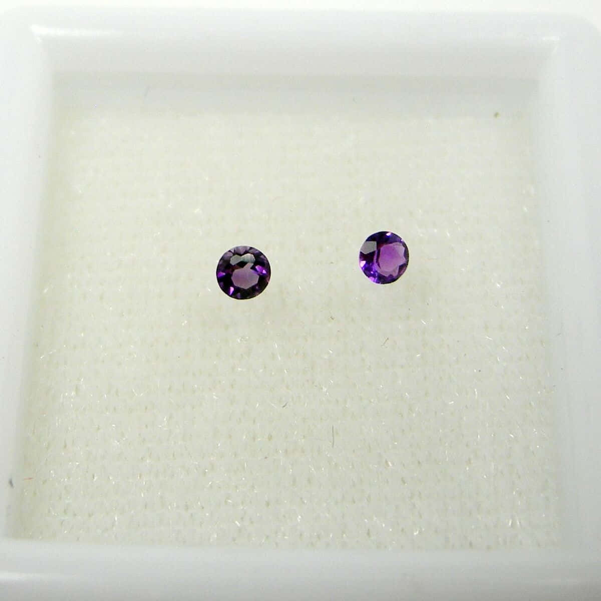 Purple Gemstone Stud Earrings Display Wallpaper