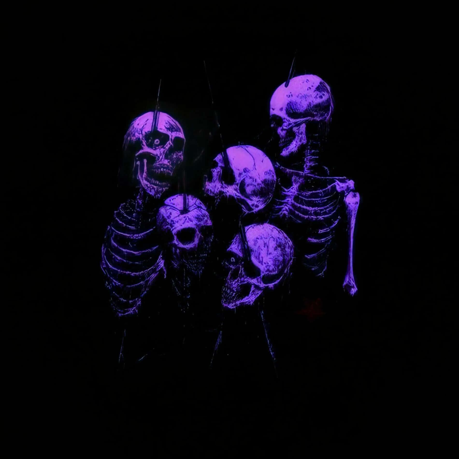 Purple Skeleton Trio Glowing Aesthetic Wallpaper