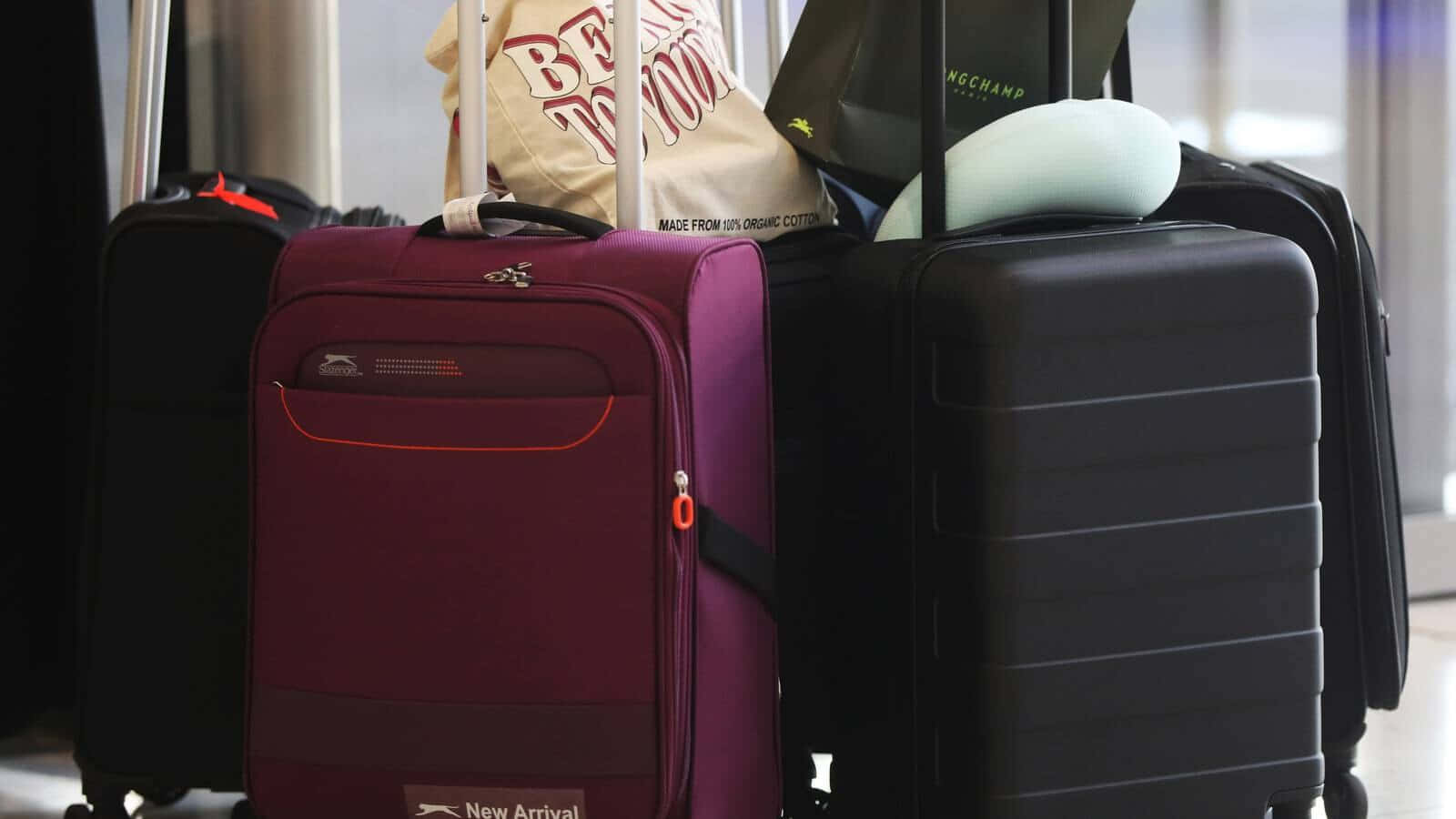 Purpleand Black Suitcases Wallpaper