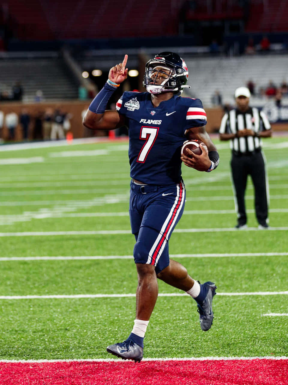 Quarterback Malik Willis Celebratingon Field Wallpaper