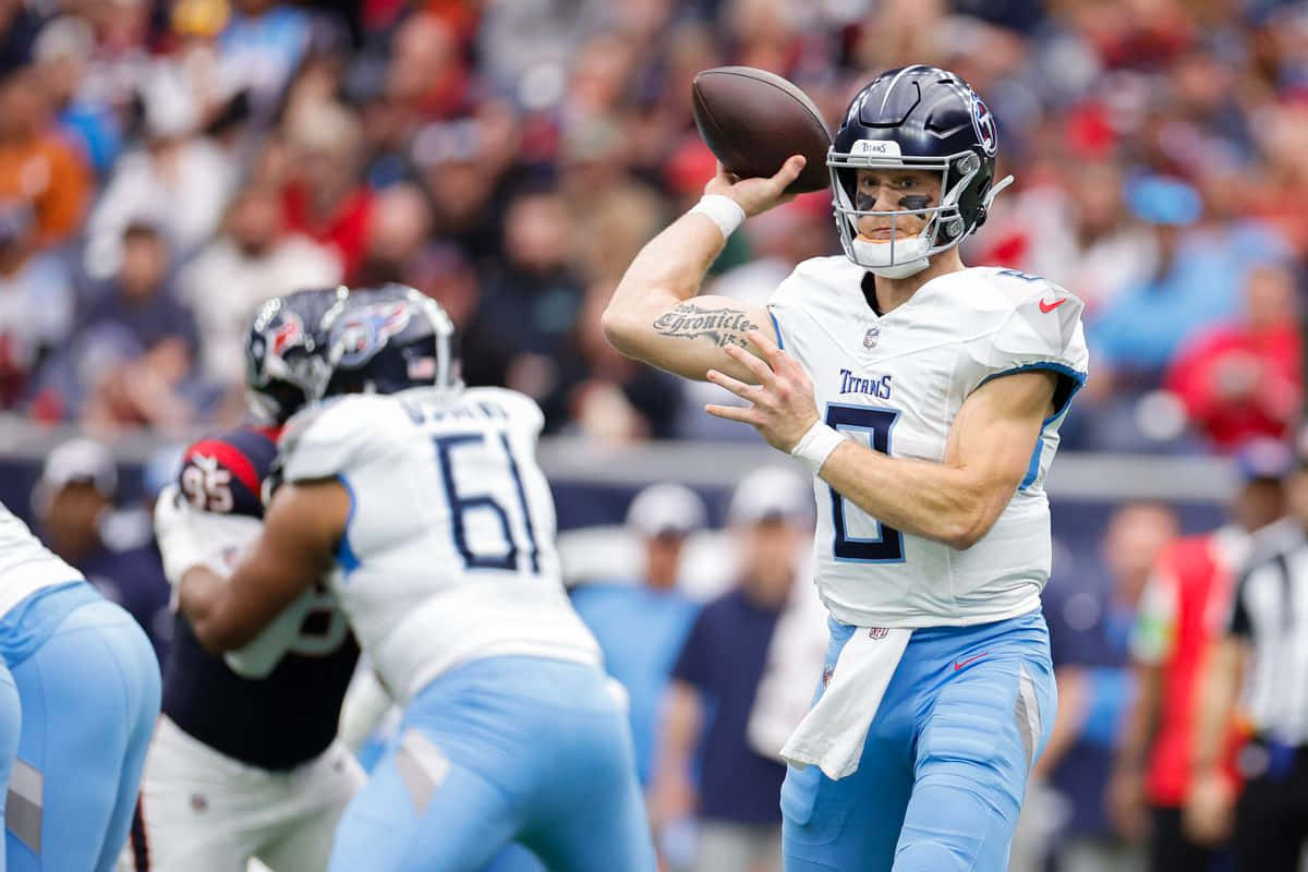 Quarterback Preparing To Throw Football Wallpaper