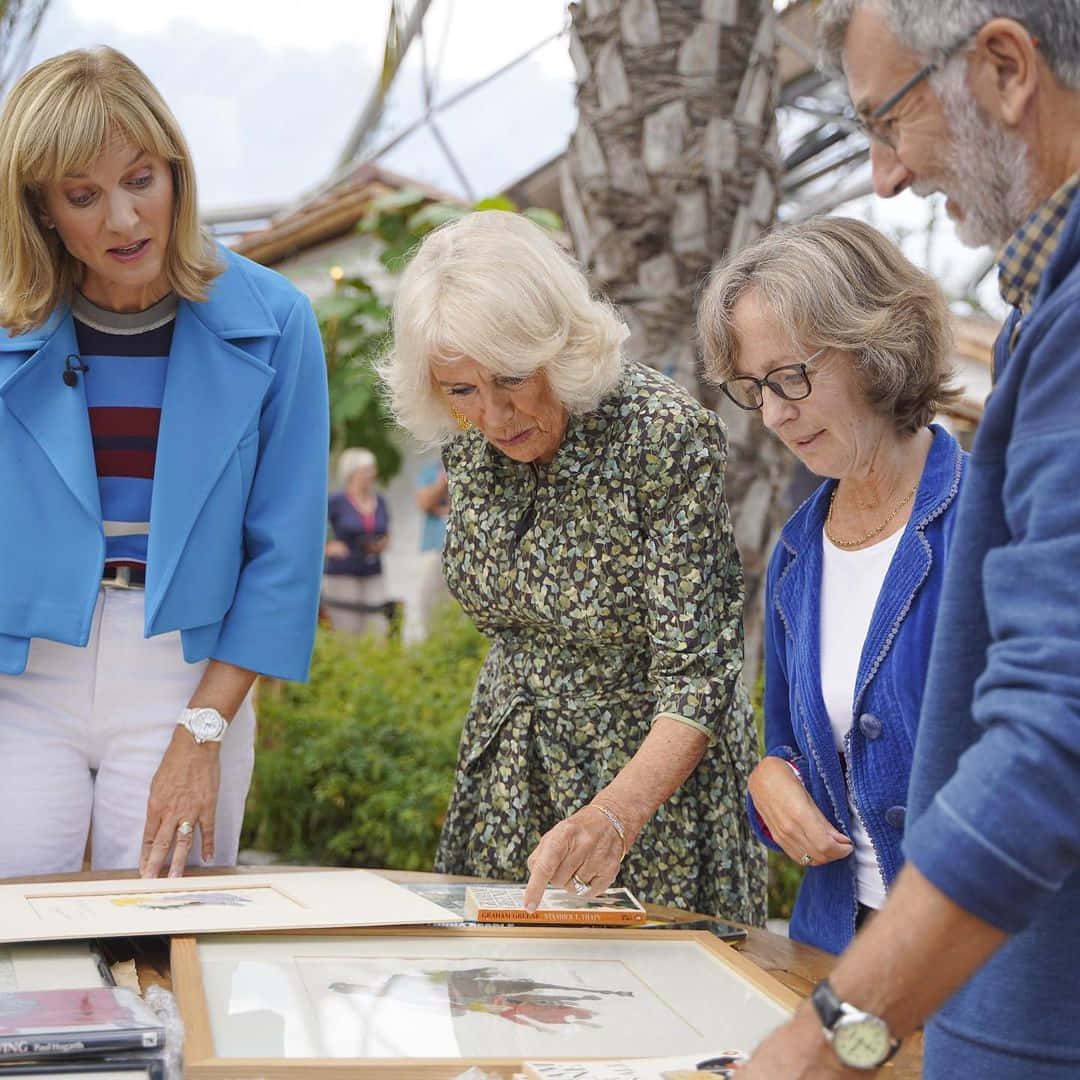 Queen Camilla Looking At Designs Wallpaper