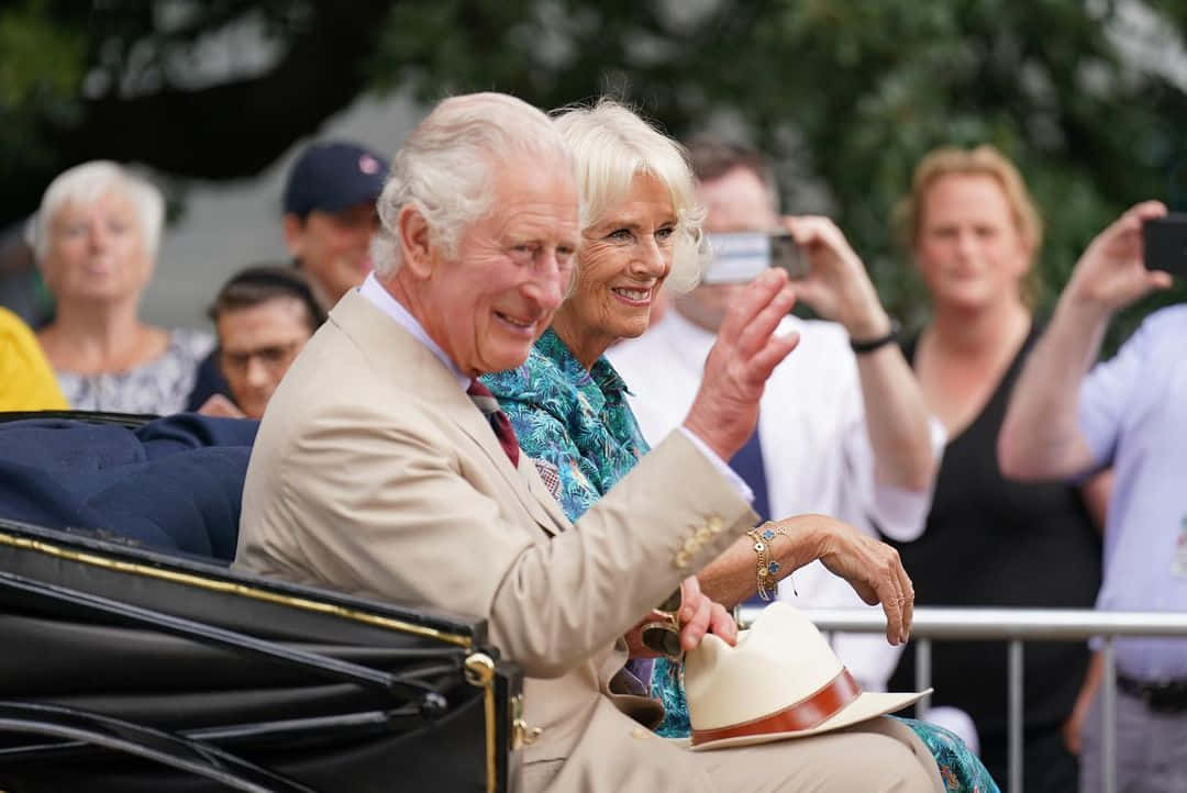 Queen Camilla Waving On Carriage Wallpaper