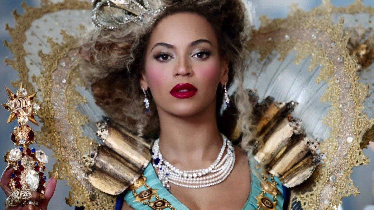 Queen Of Pop Music: Beyonce Wearing A Regal Costume Wallpaper