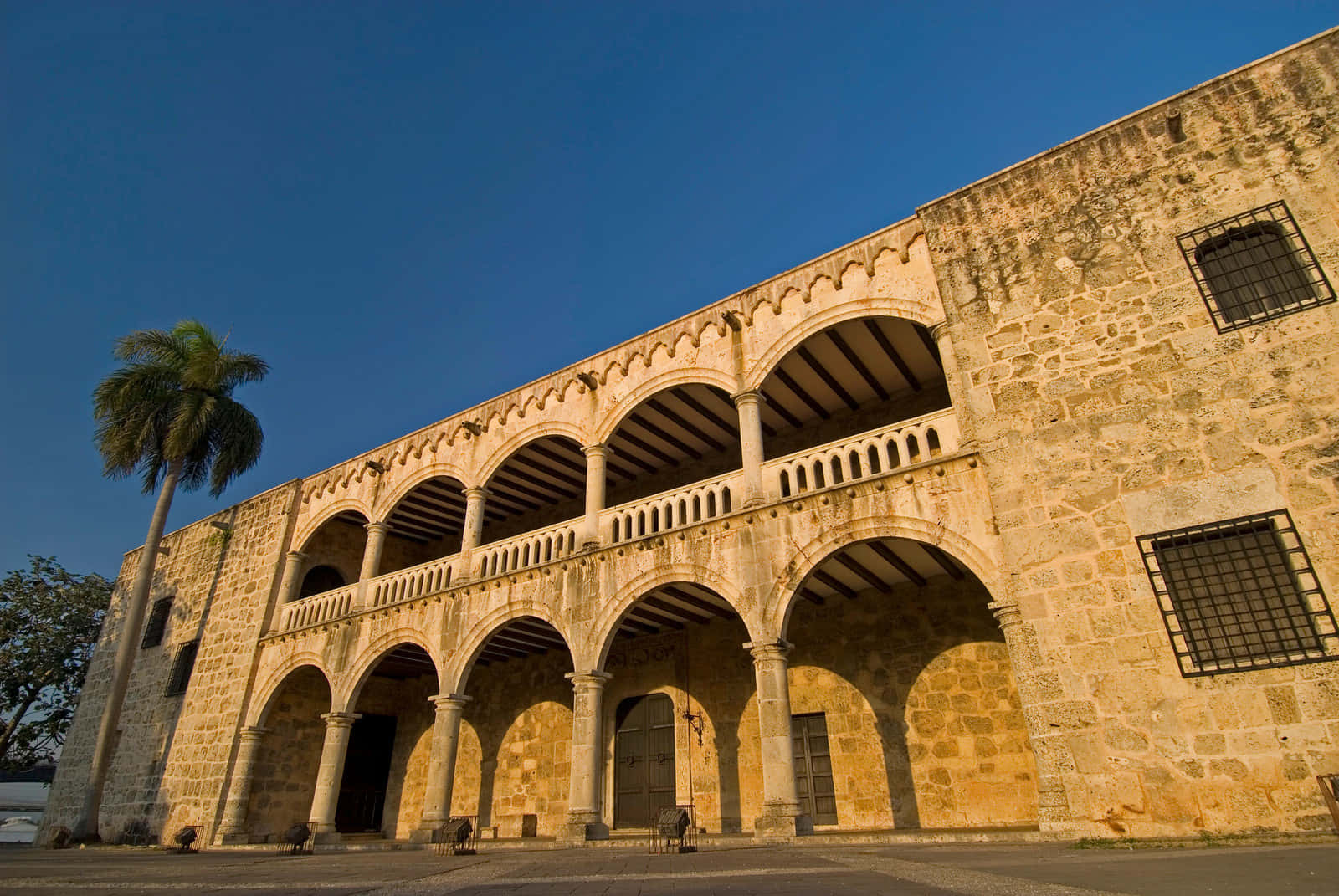 Radiant Sunset Over Alcazar De Colon Wallpaper