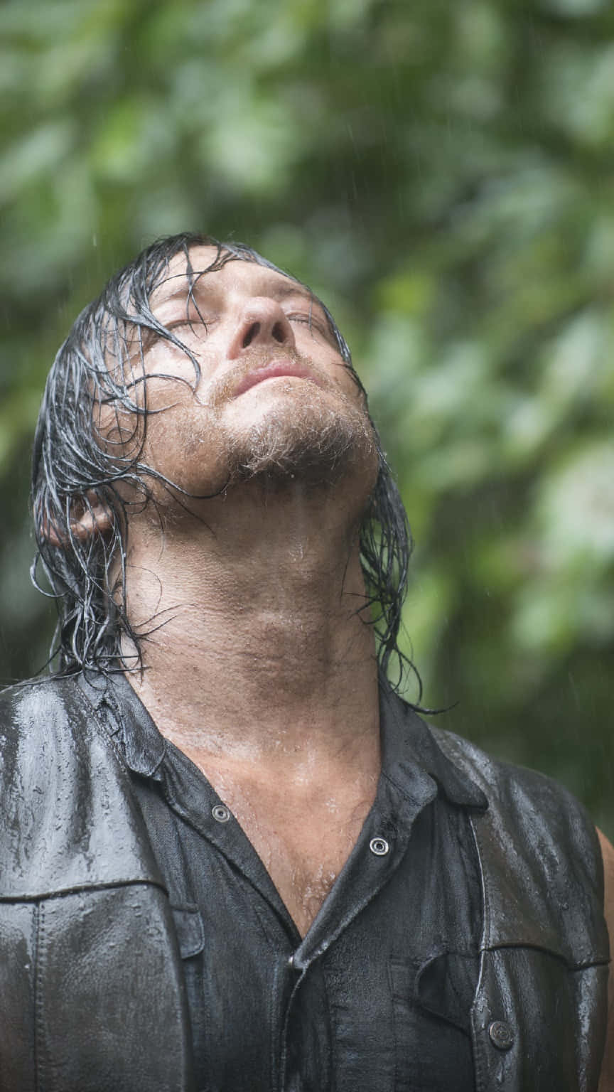 Rain Soaked Man Looking Upward Wallpaper