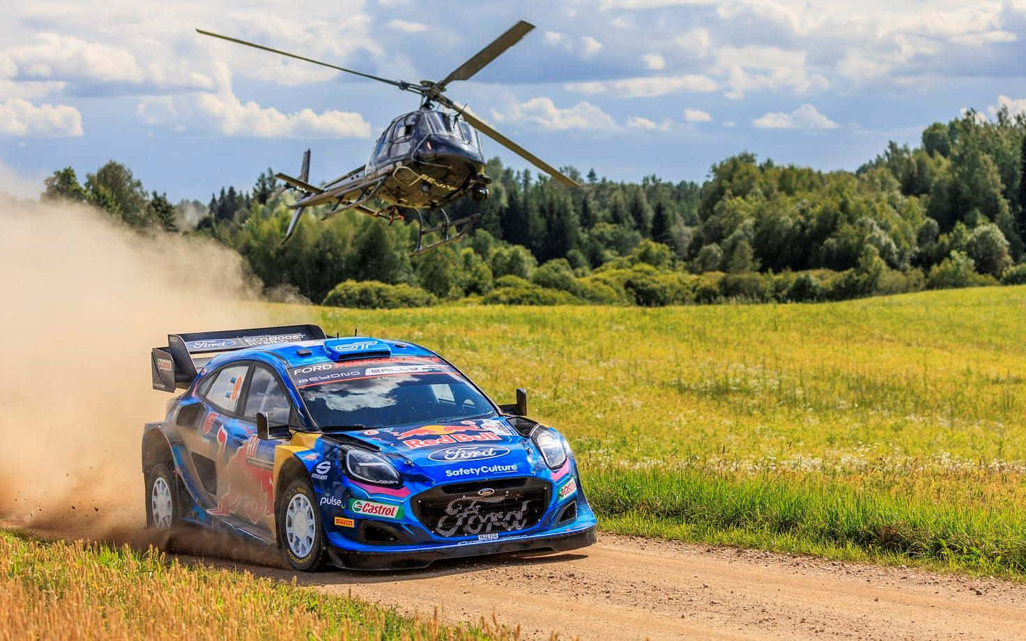 Rally_ Car_and_ Helicopter_in_ Action.jpg Wallpaper