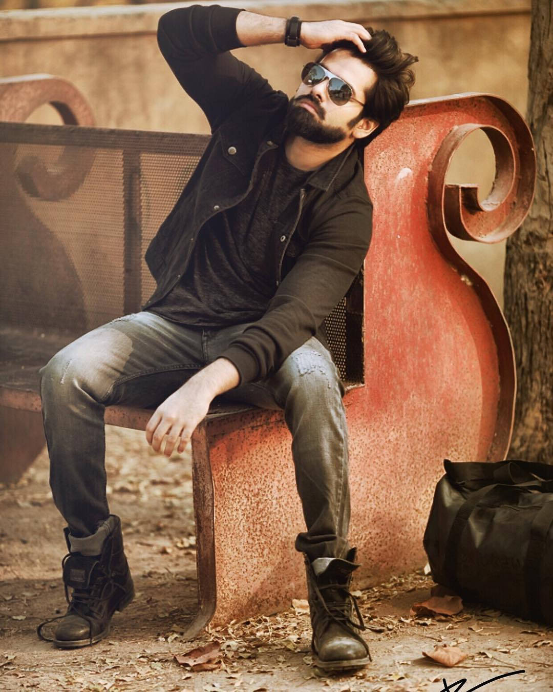 Ram Pothineni On Park Bench Wallpaper