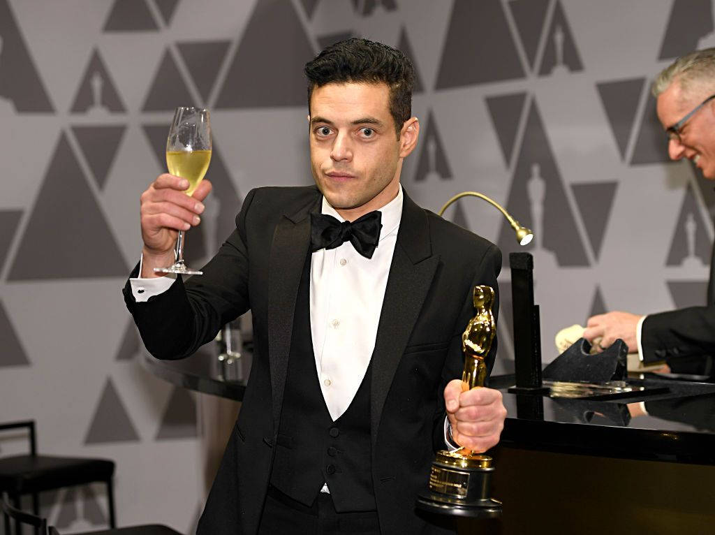 Rami Malek Toasts For Success Wallpaper