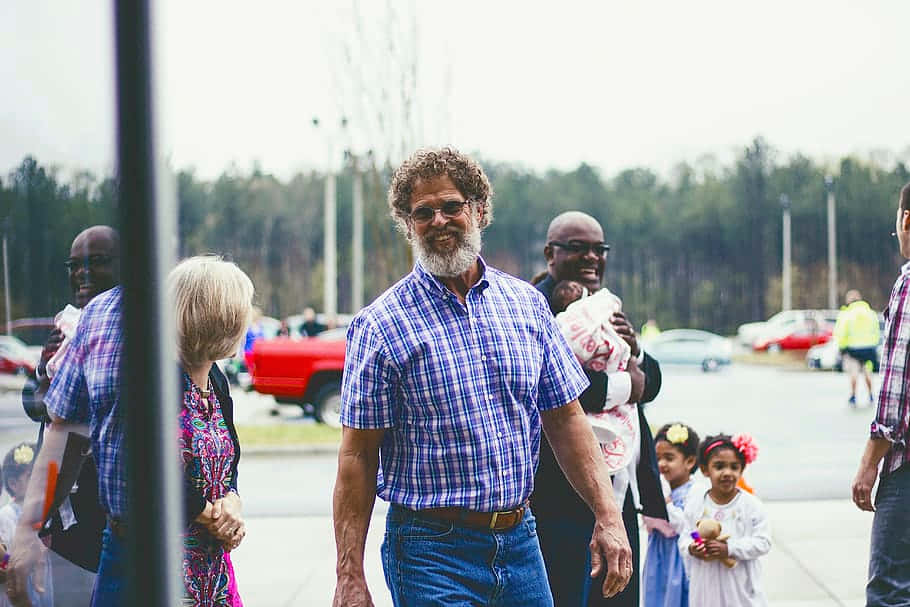 Random People Passing By A Sidewalk Wallpaper