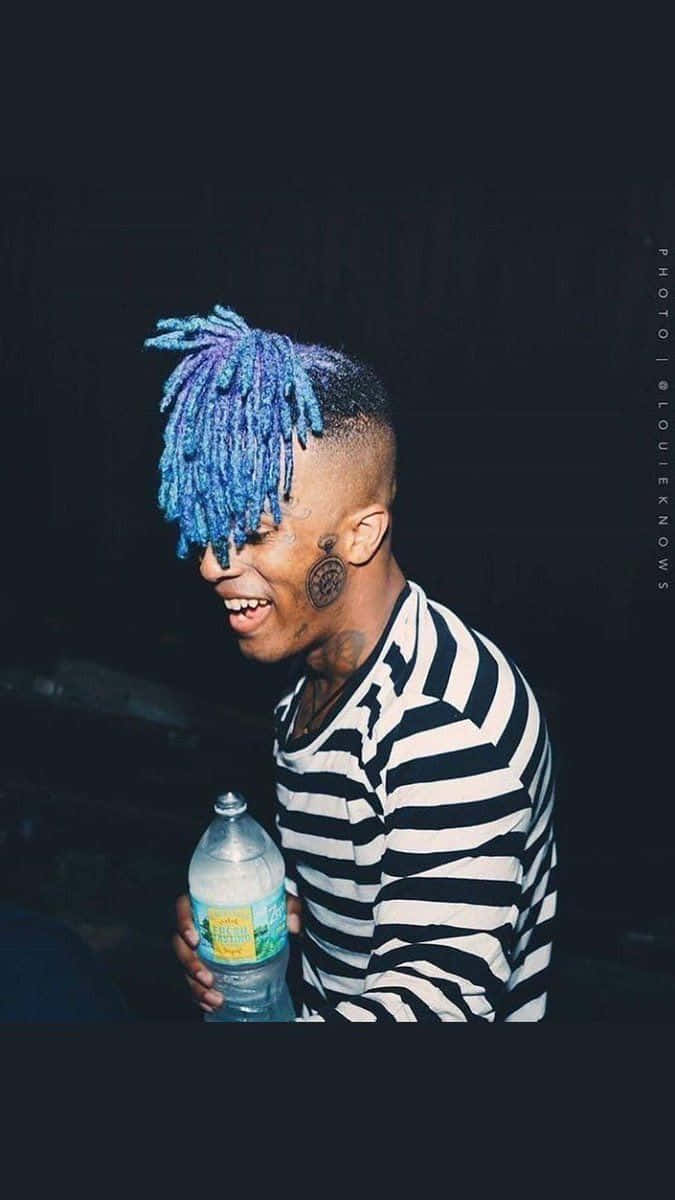 Rap Artist Xxxtentacion Poses For The Camera With Blue Hair. Wallpaper