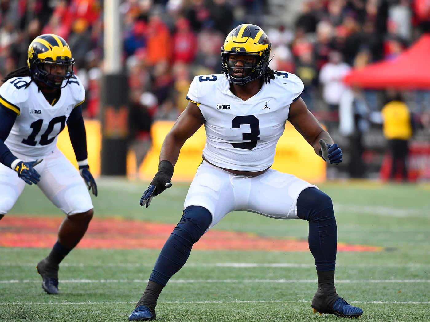 Rashan Gary Defensive Stance Football Game Wallpaper