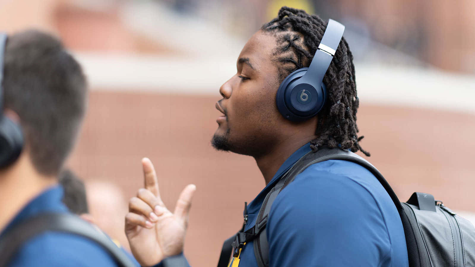 Rashan Gary Headphonesand Peace Sign Wallpaper