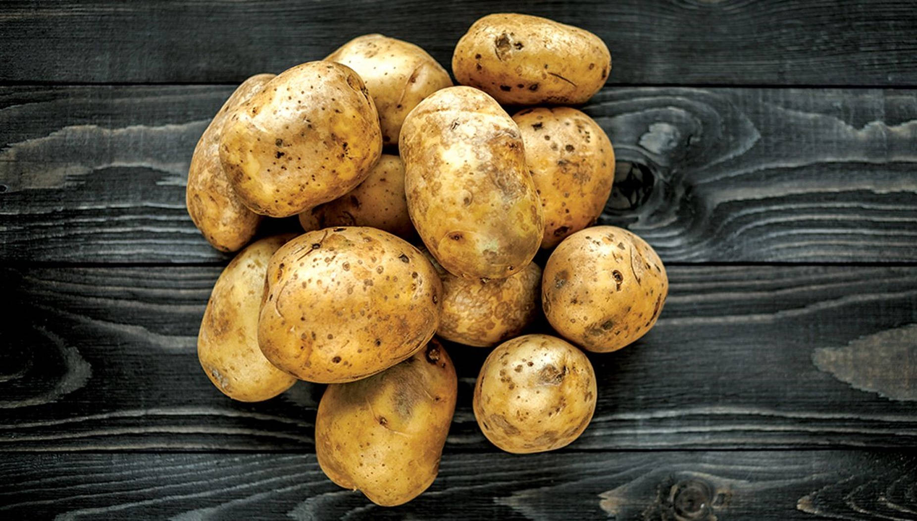 Raw Potatoes In Their Natural, Uneven Shapes Wallpaper