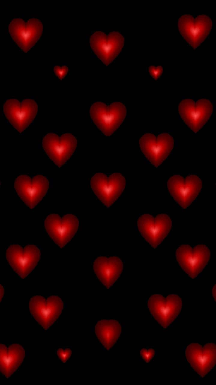 Red Hearts On Black Background Wallpaper