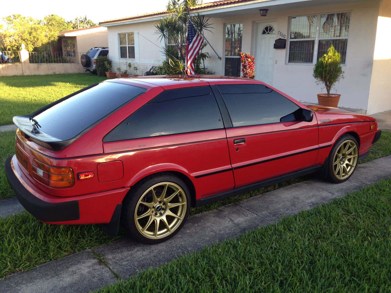 Red Isuzu Impulse Classic Car Wallpaper