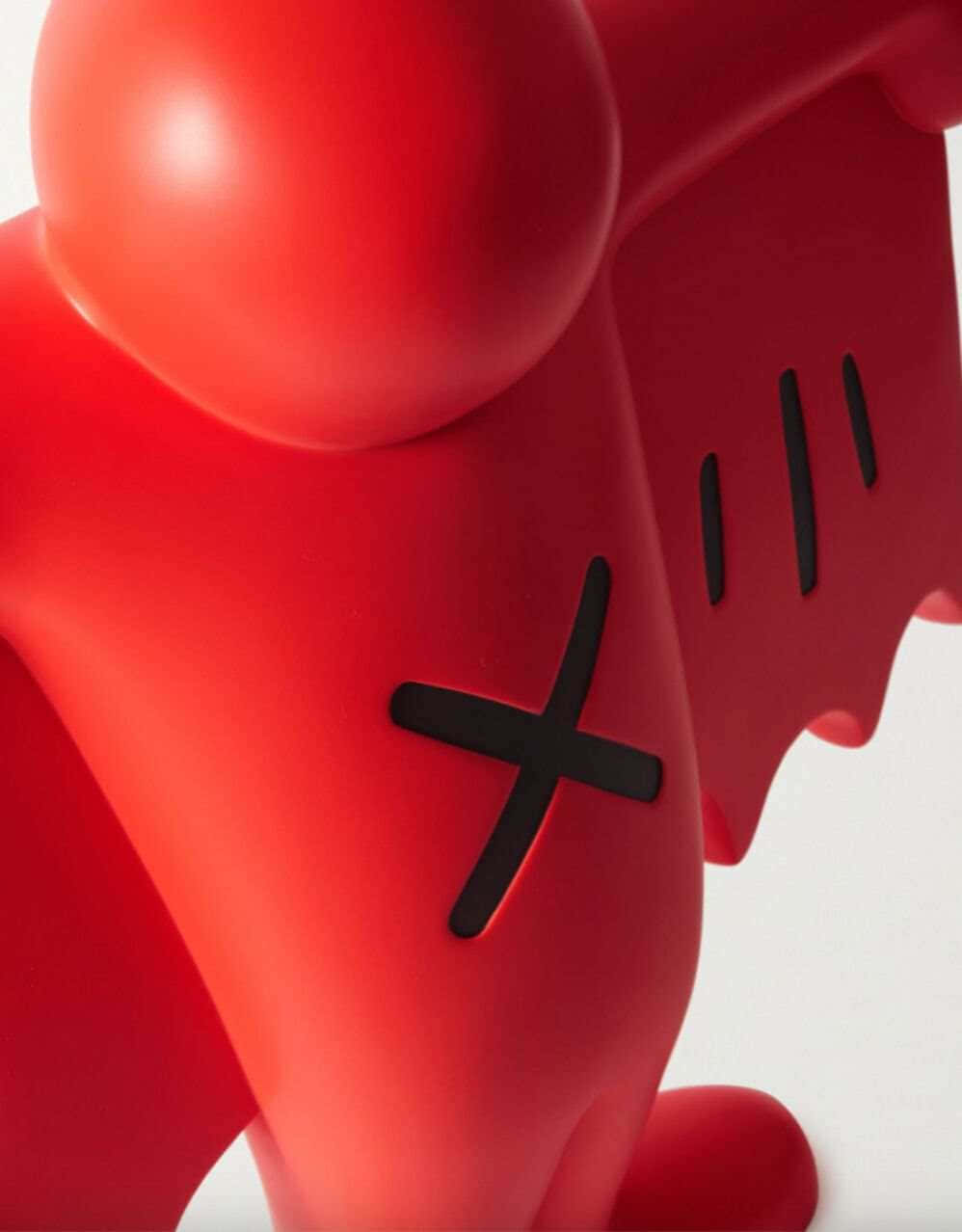 Red K A W S Figure Closeup Wallpaper