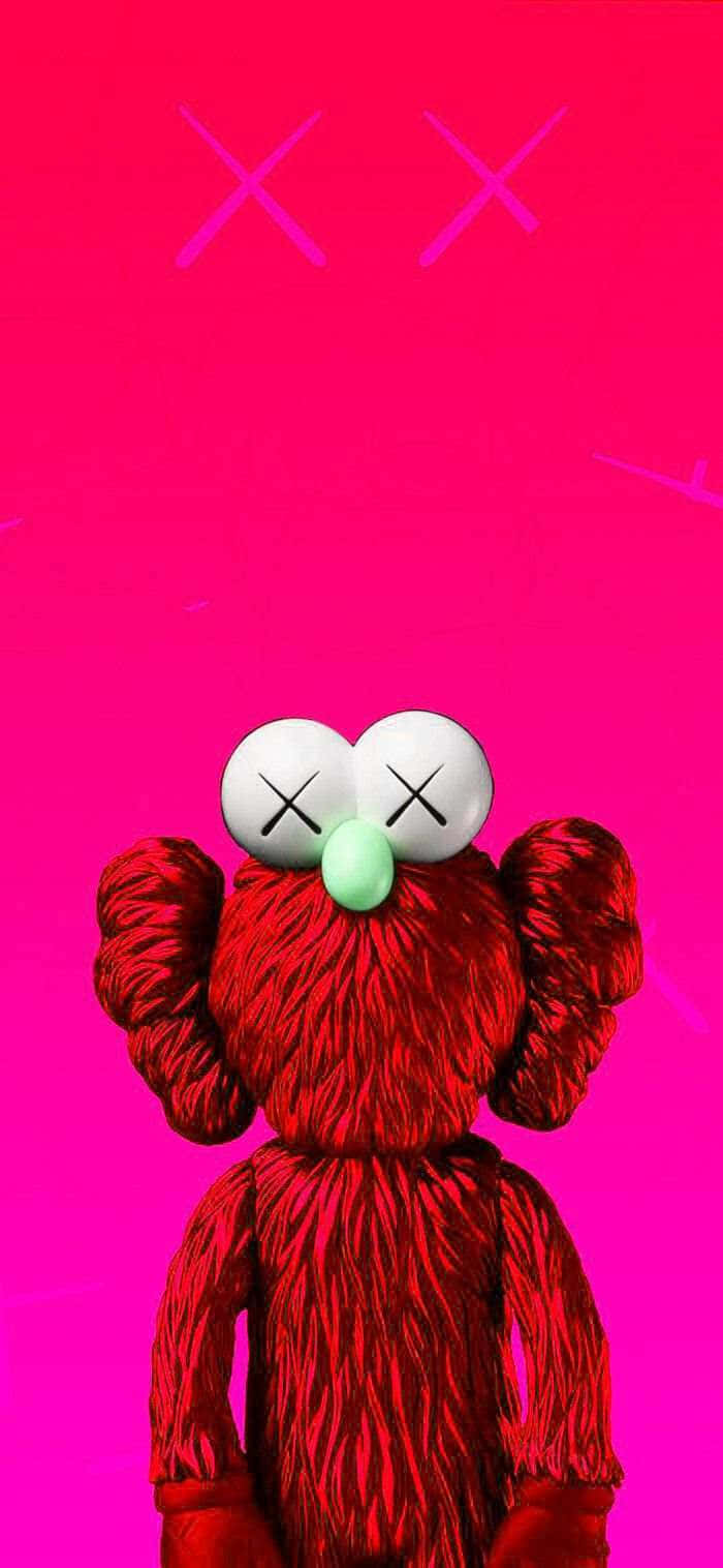 Red Kaws Figure Against Pink Background Wallpaper