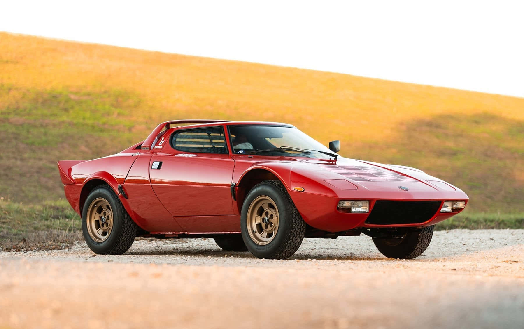 Red Lancia Stratos Classic Side View Wallpaper