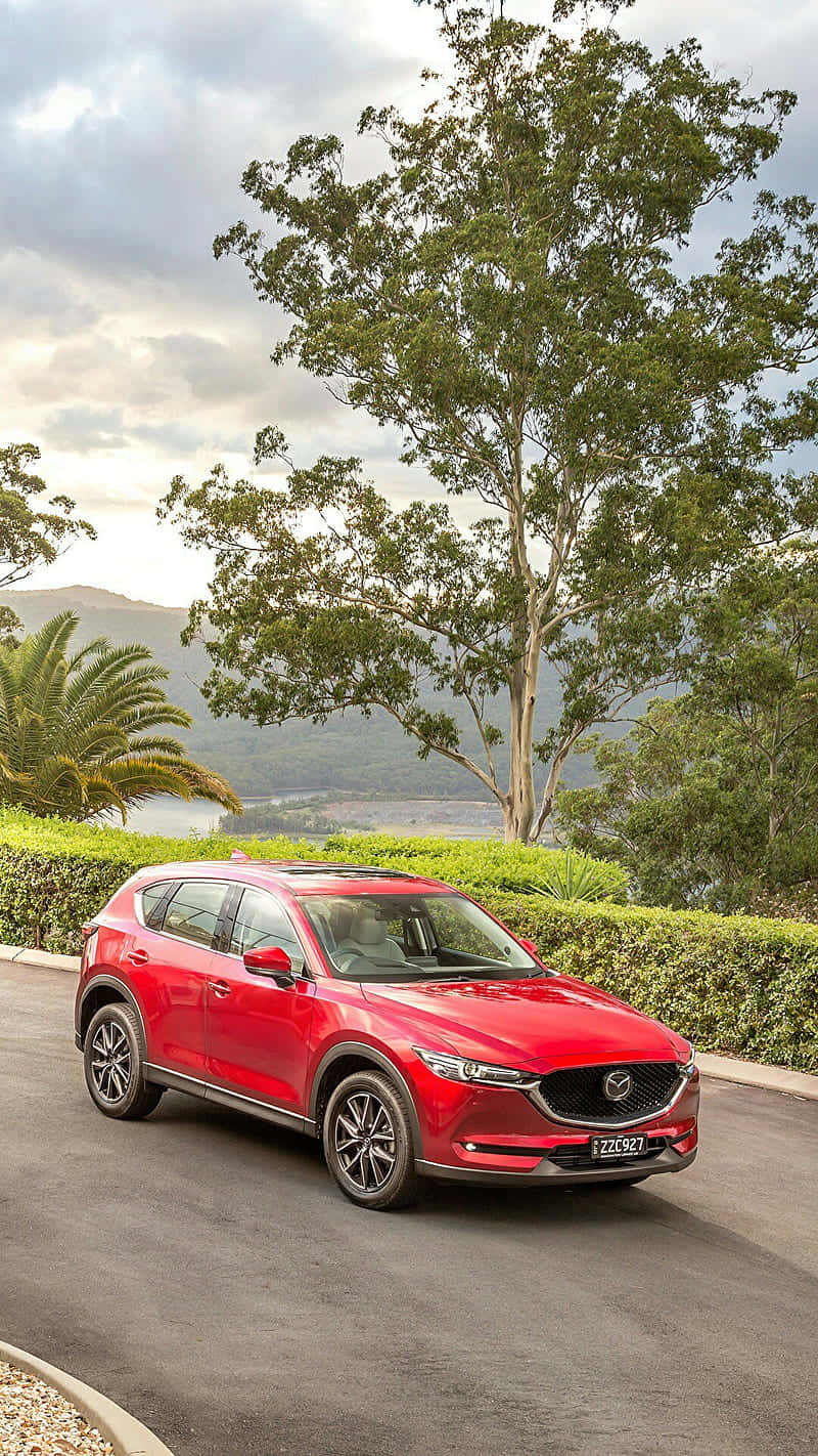 Red Mazda C X3 Scenic Backdrop Wallpaper