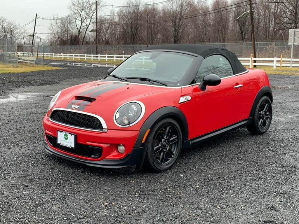 Red Mini Roadster Convertible Parked Outdoors Wallpaper