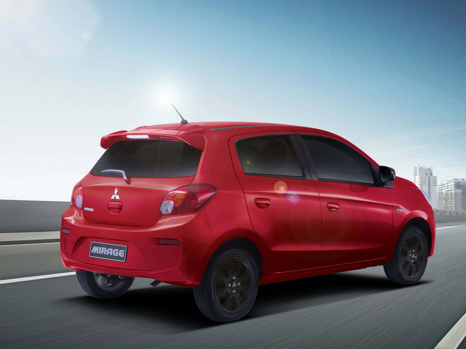 Red Mitsubishi Mirage On The Move Wallpaper