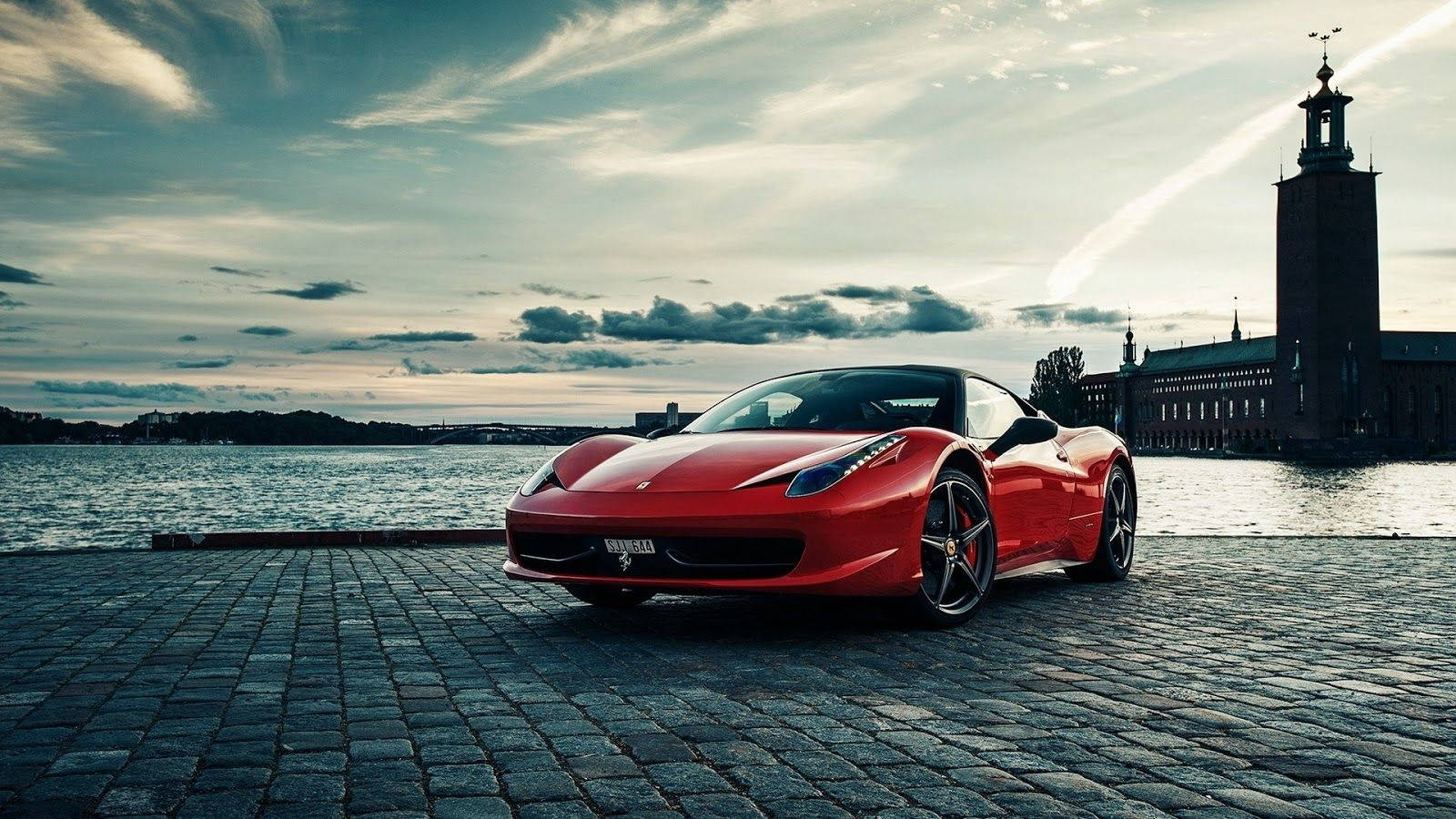 Red Sports Car Against A Black And White Backdrop Wallpaper