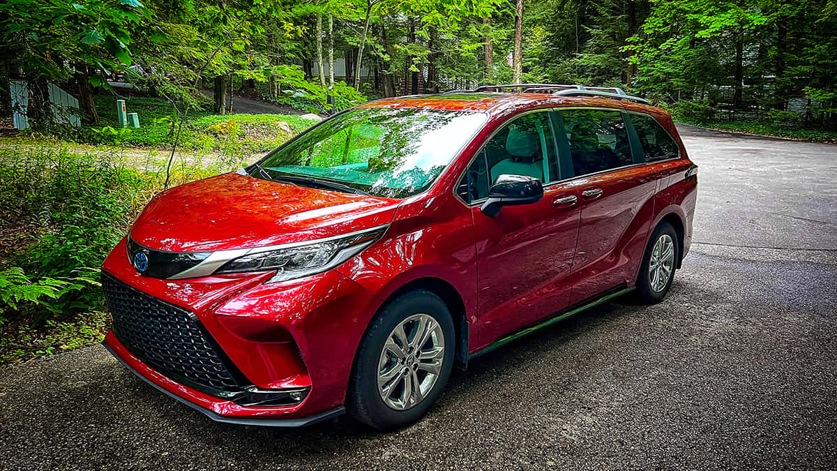 Red Toyota Sienna Minivan Forest Setting.jpg Wallpaper