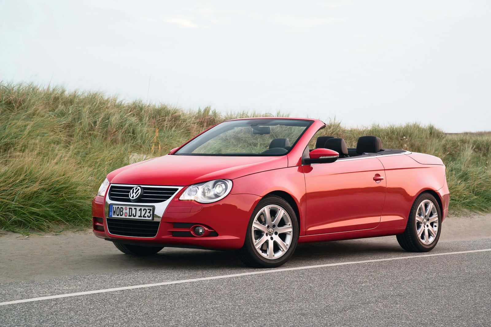 Red Volkswagen Eos Convertible Parked Wallpaper