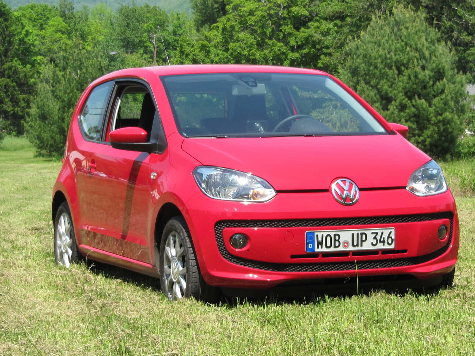 Red Volkswagen Up Parked Outdoors Wallpaper