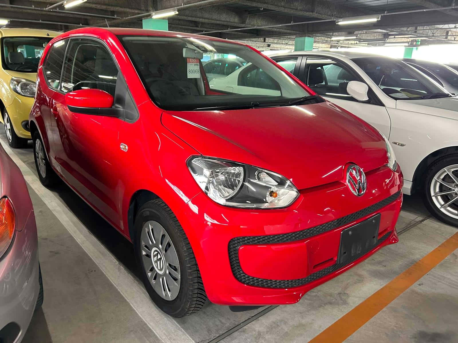 Red Volkswagen Up Parkedin Garage Wallpaper