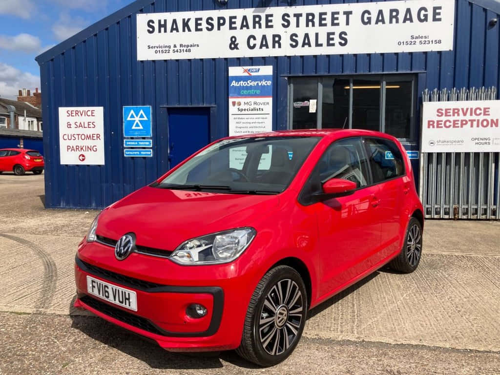 Red Volkswagen Up Shakespeare Street Garage Wallpaper