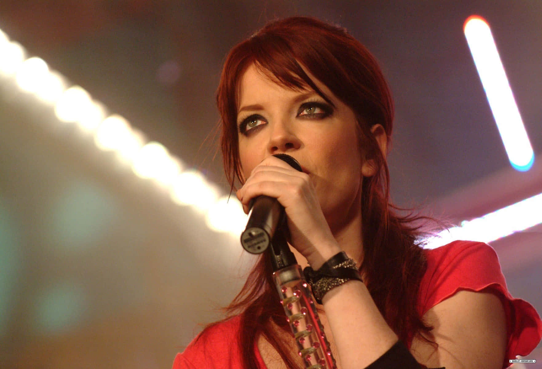 Redheaded Singer Performing Live Wallpaper