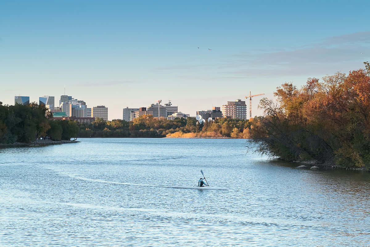 Regina Saskatchewan Riverwith Paddleboarder Wallpaper