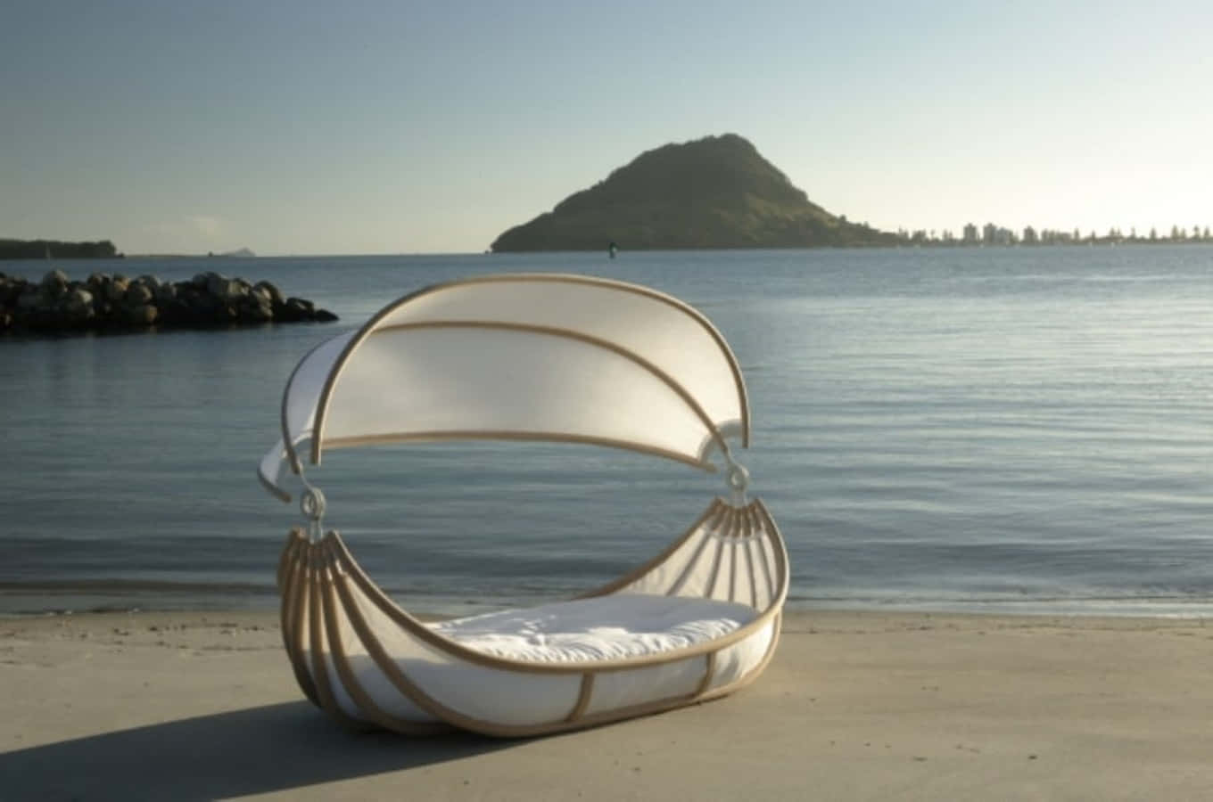 Relaxing Beach Daybed By The Ocean Wallpaper